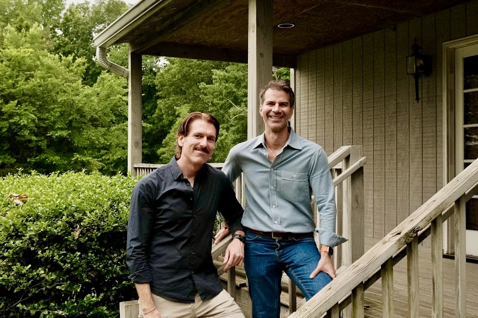 Jody and Christian, the founders of RoomCraft, standing outside together